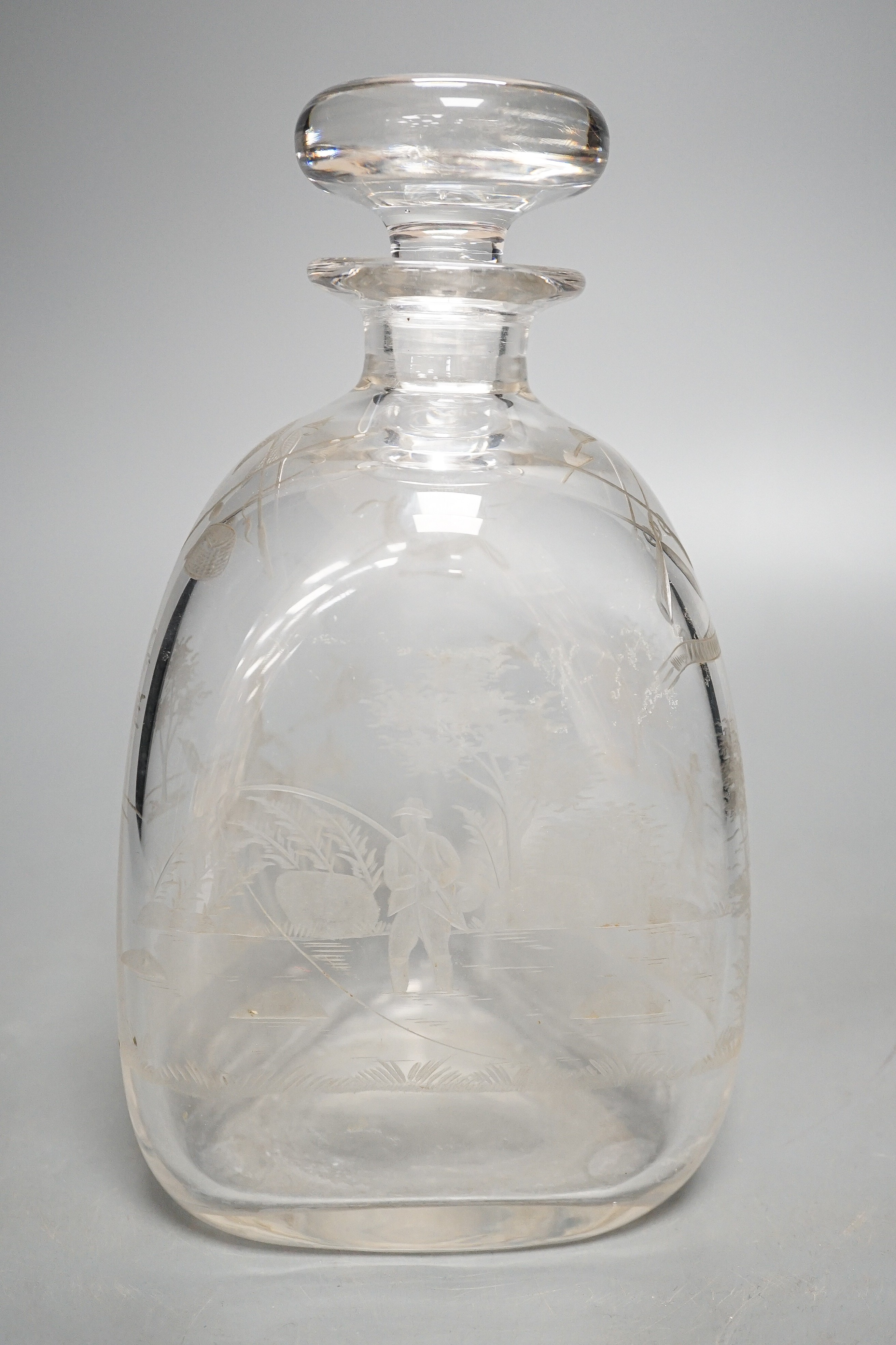 Hunting interest - A Victorian wheel engraved triangular glass decanter, and stopper, 22 cms high.